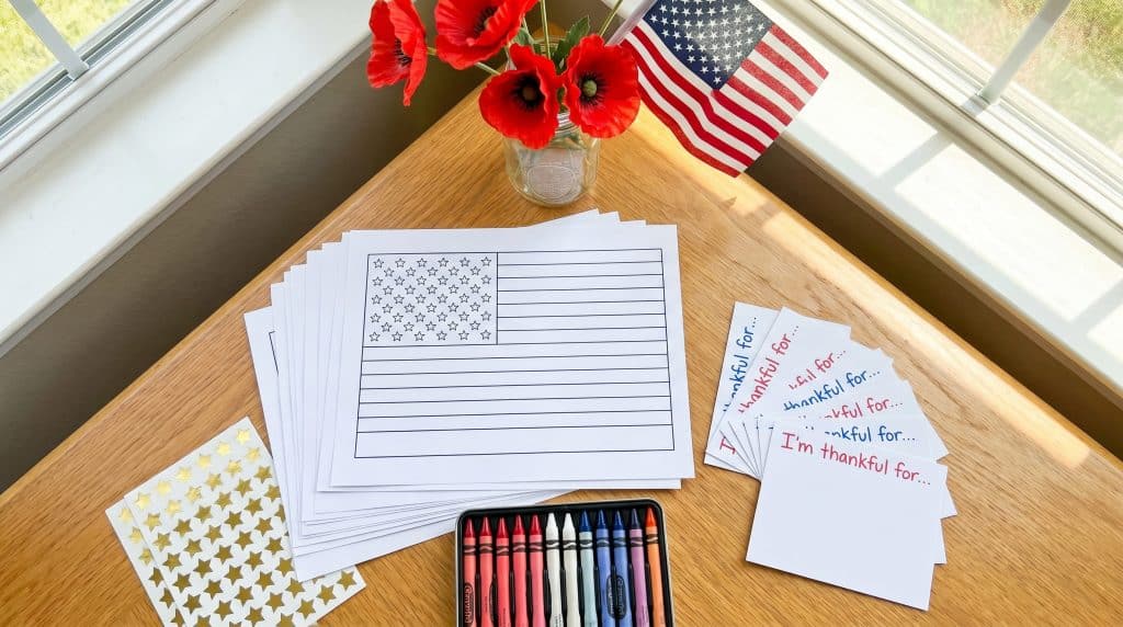 Children’s Memorial Day activity station with crafts, flags, and crayons.